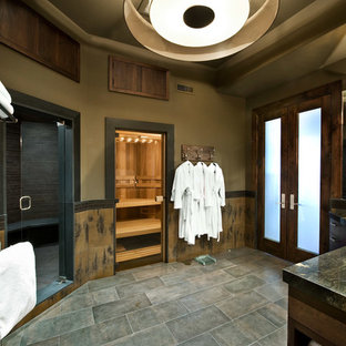 Large arts and crafts gray tile, multicolored tile and slate tile slate floor bathroom photo in Salt Lake City with brown walls, flat-panel cabinets, dark wood cabinets, an undermount sink and granite countertops