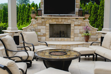 Inspiration for a mediterranean patio remodel in New York with a pergola and a fireplace