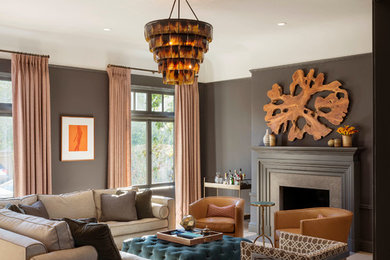Photo of a transitional living room in San Francisco with grey walls and a standard fireplace.