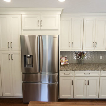 Cream Kitchen with Green Island with Butcher Block Countertop