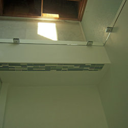 Corian Shower Pony Wall with Tile Inlay and Frameless Shower Door - Shower Doors