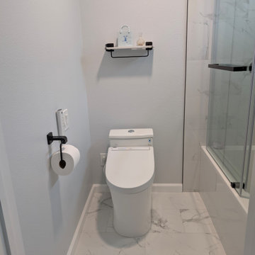 Modern Bright Monochromatic Tub & Shower Remodel with Calacatta Porcelain Tile