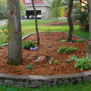 Rebuilding and mulching flower bed
