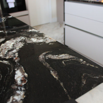 Elegant Modern Kitchen with Black Granite Island by Kudos Interior Designs