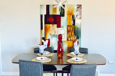 Example of an eclectic dining room design in Denver
