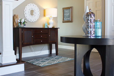 Inspiration for a large transitional porcelain tile foyer remodel in Cedar Rapids with beige walls and a white front door