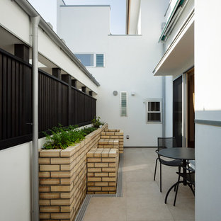 他の地域の小さいモダンスタイルのおしゃれなテラス・中庭 (日よけなし) の写真