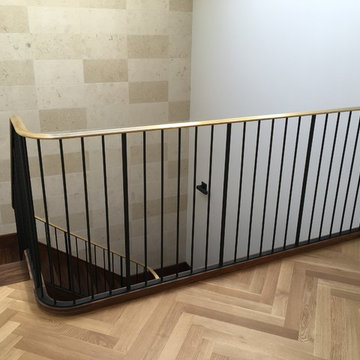Walnut Stairs with Bronze Handrail and Iron Balusters