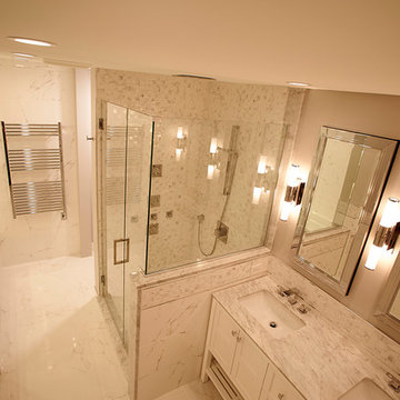 Modern Marble Bathroom with Frameless Shower and Soaking Tub