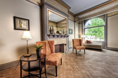 Inspiration for a large timeless formal and open concept light wood floor living room remodel in Baltimore with beige walls, a standard fireplace, a stone fireplace and no tv