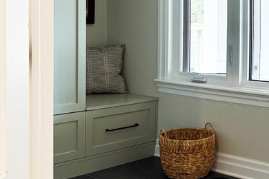 Mid-sized transitional porcelain tile and black floor entryway photo in Ottawa with beige walls and a black front door