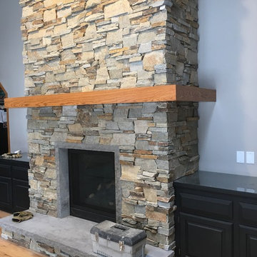 Napoleon HD with Hudson Ledgestone and Custom Hearth with Trim