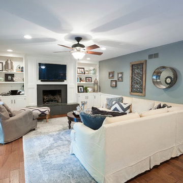 Bright & soothing living room with stone fireplace surround