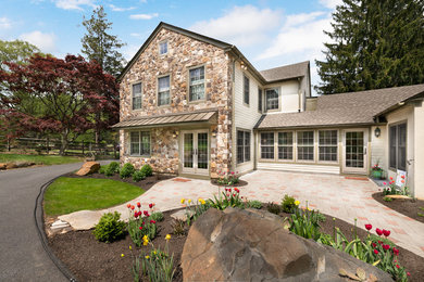 Large transitional beige two-story mixed siding exterior home idea in Philadelphia with a shingle roof