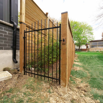Metal Gate and Wooden Board on Board Fence