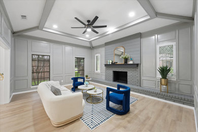Inspiration for a large contemporary open concept living room in Dallas with grey walls, vinyl floors, a standard fireplace, a brick fireplace surround, beige floor, vaulted and panelled walls.
