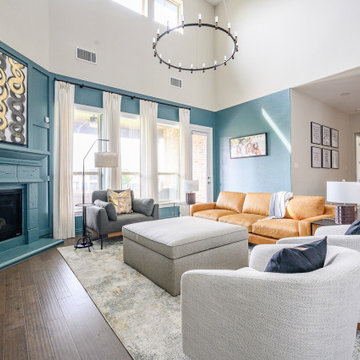 Contemporary Living Room with Teal Fireplace & Warm Leather Sofa
