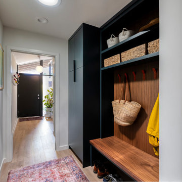 Hall Mudroom/Drop Zone with Navy Cabinetry and Walnut Accents