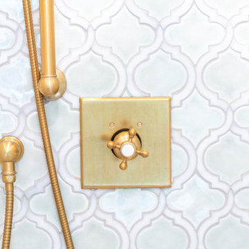 Gold Shower Trim with Moroccan Tile Accent Wall