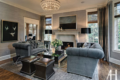 Family room - transitional medium tone wood floor family room idea in Minneapolis with white walls, a standard fireplace and a stone fireplace