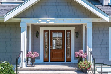 Mid-sized arts and crafts entryway photo in Boston with a glass front door