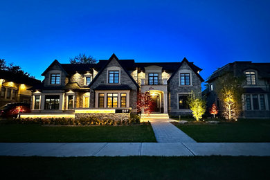Small beige two-story concrete house exterior photo in Toronto with a hip roof, a shingle roof and a black roof