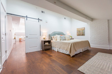 Inspiration for a small transitional master dark wood floor and brown floor bedroom remodel in Cincinnati with white walls and no fireplace