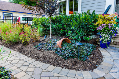 Inspiration for a small rustic courtyard stone patio remodel in Charlotte