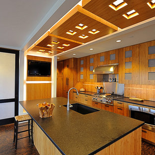 Mid-sized contemporary kitchen pantry photos - Inspiration for a mid-sized contemporary l-shaped cork floor kitchen pantry remodel in Cincinnati with an undermount sink, flat-panel cabinets, medium tone wood cabinets, granite countertops, beige backsplash and an island