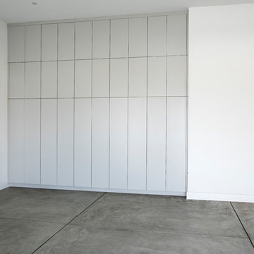 Prairie-Inspired Garage with Full-Height Storage Cabinets