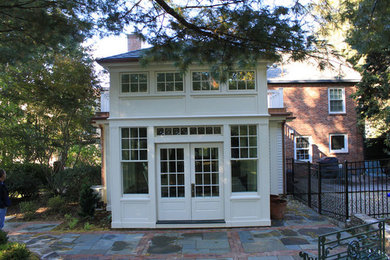 Example of a mid-sized classic white two-story wood exterior home design in Boston