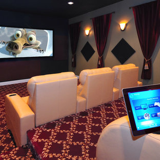 Large minimalist enclosed home theater photo in Cleveland with a projector screen