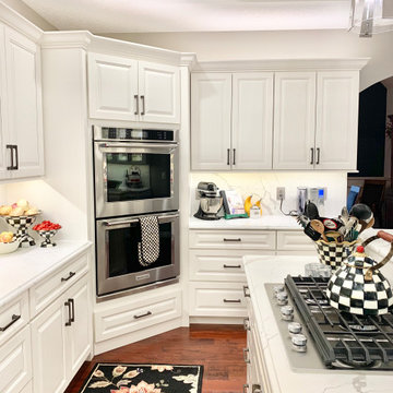 Ivory White Kitchen With Marble Look Quartz Counters and Splash