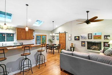 Living room - large contemporary formal and open concept medium tone wood floor and brown floor living room idea in Other with gray walls, a ribbon fireplace, a brick fireplace and a tv stand