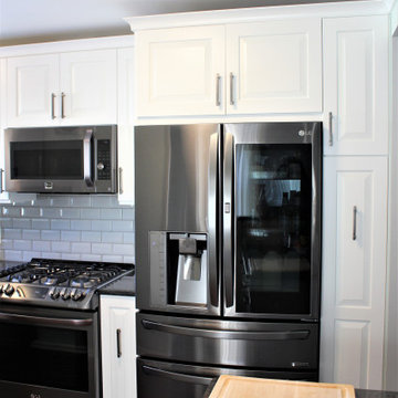 Showplace EVO Kitchen in Sierra Extra White w/ Slab Drawer Headers