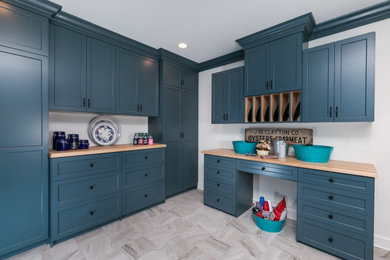 Large beach style u-shaped ceramic tile and gray floor eat-in kitchen photo in Baltimore with shaker cabinets, blue cabinets, wood countertops and beige countertops