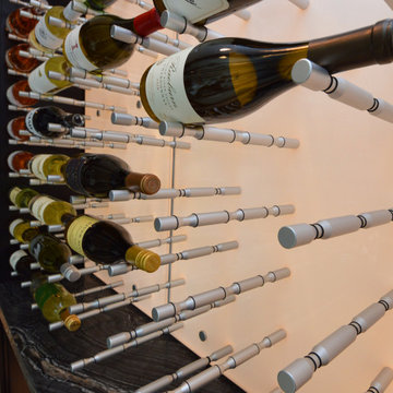 Three-Deep Metal Wine Pegs for a Sleek and Modern Wine Cellar Design