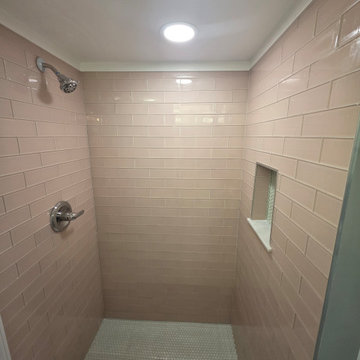 Contemporary Shower with Horizontal Light Pink Tiles and White Hexagonal Base