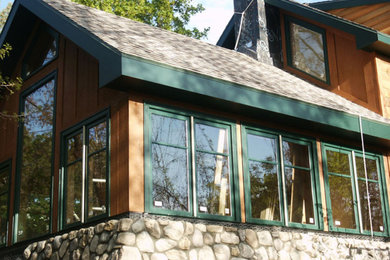 Inspiration for a large eclectic brown two-story wood exterior home remodel in Salt Lake City with a shingle roof