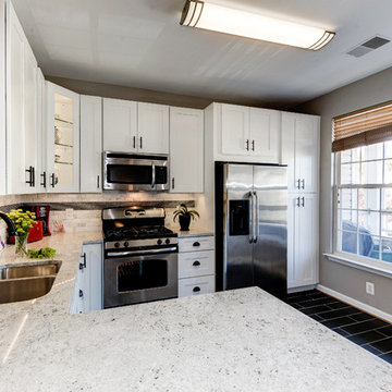 White Kitchen Remodel with Colonial White Granite and Stainless Steel Appliances