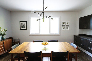 This is an example of a midcentury dining room in Birmingham.