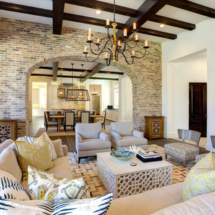 Large mediterranean open plan living room in Dallas with white walls, dark hardwood flooring, no fireplace and brown floors.