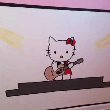 Hello Kitty playing guitar on the mural.