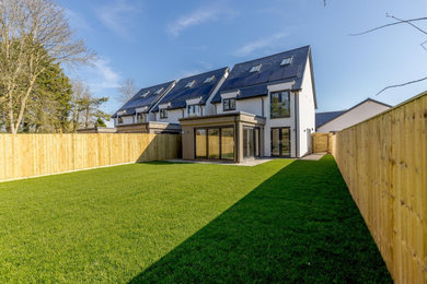 This is an example of a contemporary two-storey white house exterior in Oxfordshire.