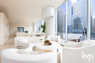 Example of a minimalist open concept living room design in Chicago with a concealed tv