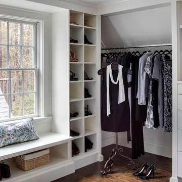 Walk in closet with cubby hole storage shelves