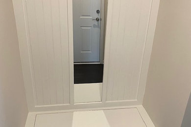 Example of a mid-sized cottage mudroom design in Charlotte