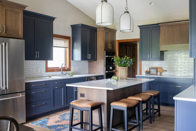 Kitchen photo in Other with an island