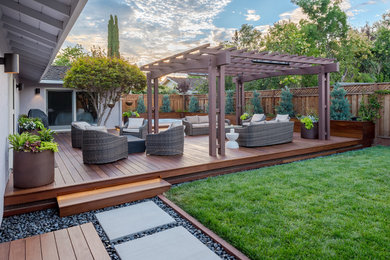 Photo of a mid-sized contemporary full sun backyard concrete paver landscaping in San Francisco for summer.