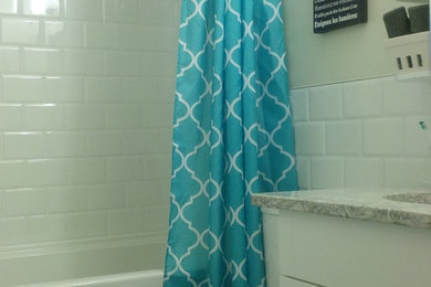 Small arts and crafts kids' white tile and ceramic tile vinyl floor bathroom photo in Other with an undermount sink, shaker cabinets, white cabinets, quartz countertops, a two-piece toilet and gray walls